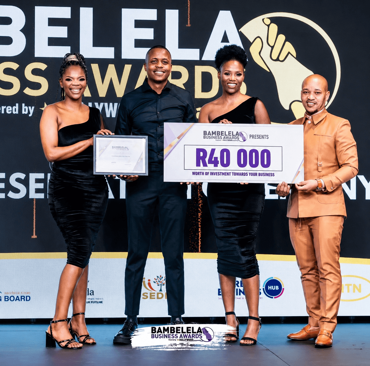 Imonti Cinematic Unit receiving the Bambelela Business Award on stage